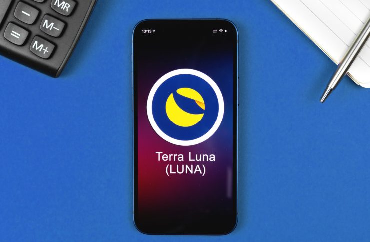 Terra Luna symbol. Trade with cryptocurrency, digital and virtual money, banking with mobile phone concept. Business workspace, table top view