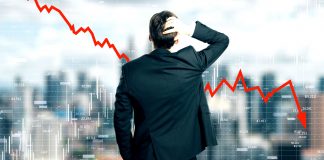 Back view of stressed young businessman looking at downward red arrow on blurry city background. Decrease, stats and economy concept. Multiexposure