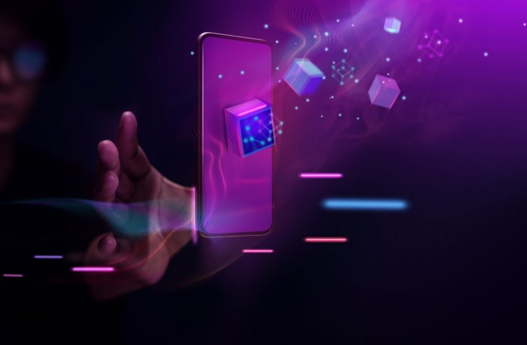 Metaverse and Blockchain Technology Concepts. Person with an Experiences of Metaverse Virtual World via Smart Phone. Futuristic Tone. Conceptual Photo