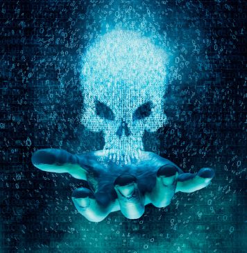 Computer crime and virus concept / 3D illustration glowing skull formed by binary digits floating above open hand